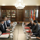 Los representantes de la Generalitat y del Gobierno en la reunión de la Junta de Seguridad. A. DALMAU