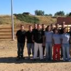 Los integrantes de la comisión de fiestas de Altobar posan delante de la nueva plaza de toros