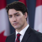 Canadian Prime Minister Justin Trudeau listens to a question during an end of session news conference in Ottawa