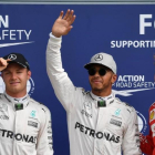 Nico Rosberg, Lewis Hamilton y Sebastian Vettel, hoy, en Monza, tras la calificación del GP de Italia.