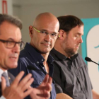 Artur Mas, Raül Romeva y Oriol Junqueras, este lunes, 21 de septiembre, en un acto de Junts pel Sí.