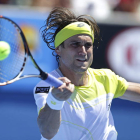 Ferrer devuelve una bola en su partido ante Smyczek.