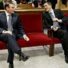 Ibarretxe y el lendakari actual, Patxi López, se sentaron en el banquillo hace un año.
