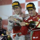 Fernando Alonso, Jenson Button y Sebastian Vettel se rocían con champán en el podio.
