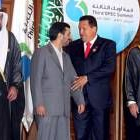 Chávez conversa con el presidente iraní en la inauguración de la OPEP