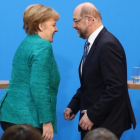 Angela Merkel y Martin Schulz, tras la rueda de prensa de presentación del acuerdo de gobierno, en Berlín.