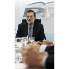 Mariano Rajoy, ayer, en la sede del PP en Génova.