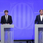 Carles Puigdemont y Oriol Junqueras, en la rueda de prensa en la que se anunciaron los últimos cambios en el Govern.