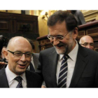 Mariano Rajoy y Cristobal Montoro durante el pleno celebrado en el Congreso de los Diputados.