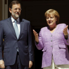 Rajoy, junto a la canciller alemana, Angela Merkel, a las puertas del Palacio de la Moncloa.