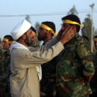Integrantes de la milicia chiíta iraquí Kitab al-Abbas participan en un entrenamiento.