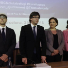 Albert Royo, Carles Puigdemont, Ada Colau y María Jesús Vega en el Forum internacional sobre acogida e integración de personas refugiadas de la Unión Europea, en Barcelona.