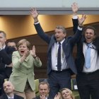 (L-R)  UEFA President Michel Platini, German Chancellor Angela Merkel, president of the German soccer federation (DFB) Wolfgang Niersbach and German Interior Minister Hans-Peter Friedrich react after a goal that was disallowed during the quarter-final soc