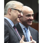 Olli Rehn, a la izquierda, junto a Luis de Guindos.