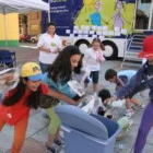 Un grupo de niños juegan en la caravana Proniño en Ponferrada