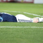 Leo Messi, en el suelo tras caer eliminado en el partido de cuartos ante Uruguay.