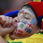 Un niño con las banderas de varios países pintadas en su cara, durante el Mundial de Brasil.