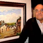 José Olivé, junto a uno de sus cuadros de tema berciano