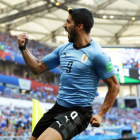 Suárez celebra con rabia el único gol de Uruguay. SHAWN THEW