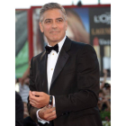 El actor estadounidense George Clooney sonríe a su llegada a la presentación de la película ‘Gravity’ en el Festival de Cine de Venecia.