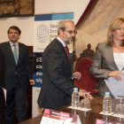 El director de las jornadas, Mañueco, el rector salmantino y la consejera de Hacienda, ayer.