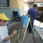 Dos de los participantes del certamen de pintura rápida en plena ejecución de sus obras