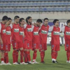 Los jugadores esperan con tensión antes de los penaltis.