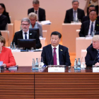 El presidente de China Xi Jinping junto a Donald Trump y Angela Merkel en la cumbre del G20. LUKAS COCH
