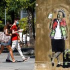 Un graffiti con una caricatura de Juan Carlos I en una calle de Valencia. QUIQUE GARCÍA