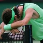 Carlos Moyà se lamenta tras su prematura eliminación en el primer grande de la temporada