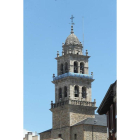 La torre de la basílica adornada con los colores de la Deportiva