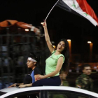 Aficionados sirios celebran el empate ante Irán.