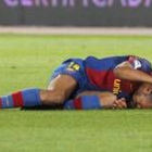 Henry se duele durante el encuentro que el equipo blaugrana disputó frente al Almeria el domingo