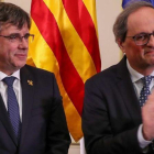 Carles Puigdemont y Quim Torra, este lunes, durante su acto en Bruselas.