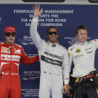 Fernando Alonso, Lewis Hamilton y Kimi Raikkonen, saldrán tercero, primero y segundo, respectivamente, en el GP de China. Mark Baker