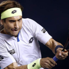 David Ferrer devuelve una bola al búlgaro Grigor Dimitrov durante el partido de octavos.