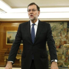 Rajoy, frente a un crucifijo, durante su toma de posesión como presidente, el pasado 31 de octubre en el palacio de la Zarzuela.