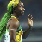 Fraser-Pryce, con los colores de la bandera jamaicana en el pelo.