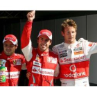 Massa, Alonso y Button celebran la clasificación del Gran Premio de Italia, hoy.
