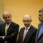 El ministro de Economia, Luis de Guindos, junto a Cristobal Montoro, Jesus Posada y Jose Manuel Soria, durante el acto de posesión de altos cargos en el ministerio.