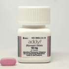 Un bote y una pastilla de Addyi, el nombre comercial del fármaco.