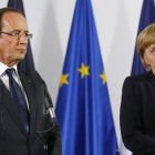 Francois Hollande y Angela Merkel, durante el acto de homenaje a De Gaulle.