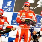 Fernando Alonso con su compañero Massa y el británico Hamilton de McLaren Mercedes.