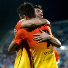 David Villa celebra con su compañero Leo Messi el gol marcado por el asturiano ante el Getafe.