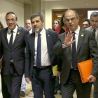 Josep Rull, Jordi Sánchez y Jordi Turull, tras recoger su acta de diputado.