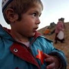 Un niño de una colonia judía de Gaza con la estrella de David naranja en su pecho