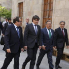 Jordi Jané, Carles Puigdemont, Juan Ignacio Zoido y Enric Millo, en el Pati dels Tarongers de la Generalitat, en julio.