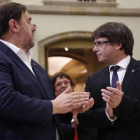 Oriol Junqueras y el president Puigdemont tras el pleno.