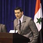 Dos responsables del Gobierno sirio comparecen en una rueda de prensa.