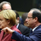 Angela Merkel y Franços Hollande, al inicio de la cumbre, en Bruselas.